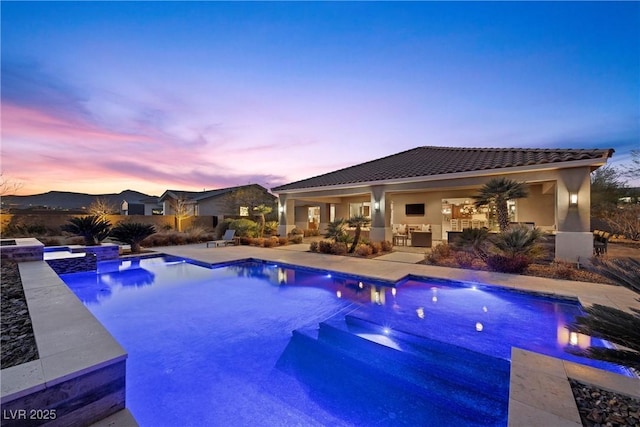 421 Foxhall Rd, Henderson, NV 89002 - pool at dusk with a patio and a pool with connected hot tub