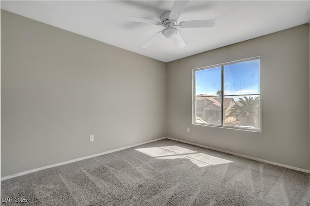 unfurnished room with ceiling fan, carpet floors, and baseboards