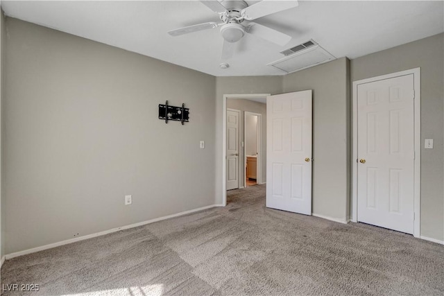 unfurnished bedroom featuring baseboards, visible vents, carpet floors, and ceiling fan