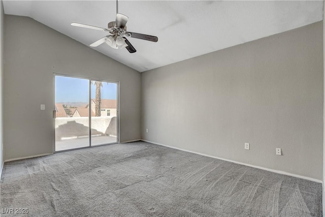 empty room with ceiling fan, lofted ceiling, carpet flooring, and baseboards