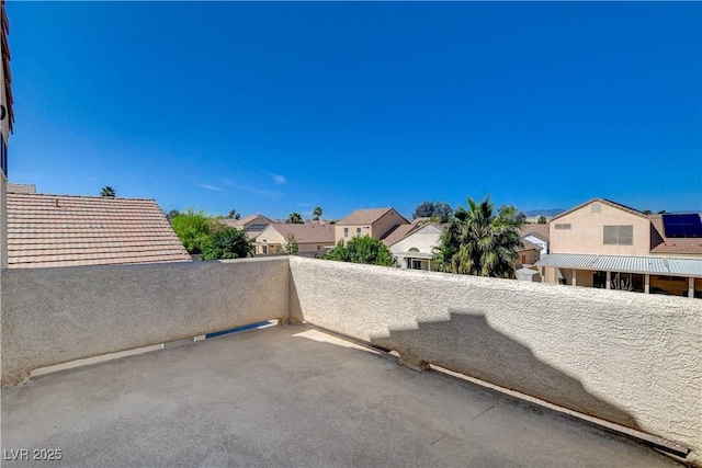view of patio / terrace with a balcony and a residential view