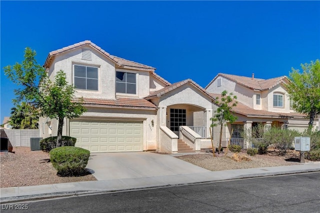 view of front of home featuring a tile roof, driveway, an attached garage, cooling unit, and stucco siding