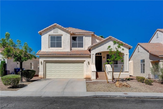 traditional-style home with a tile roof, a porch, concrete driveway, an attached garage, and stucco siding