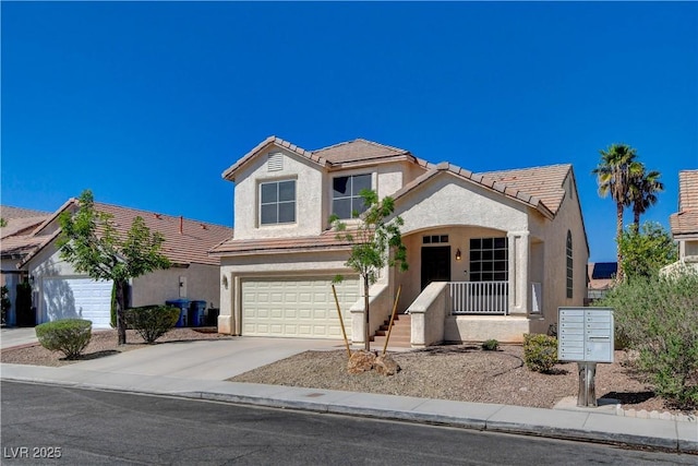 traditional-style house with a garage, concrete driveway, a tiled roof, and stucco siding