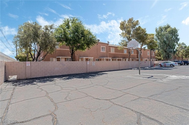 exterior space with a residential view and fence