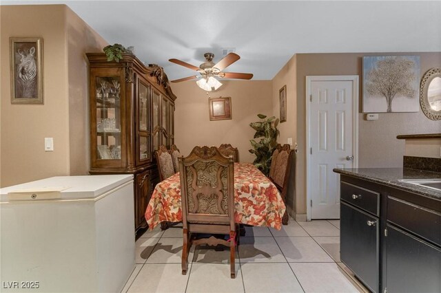 dining area featuring visible vents, ceiling fan, and light tile patterned flooring
