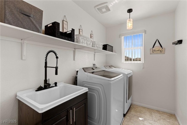 10052 Silver Comet Ct, Las Vegas, NV 89178 - washroom featuring washer and dryer, cabinet space, baseboards, and light tile patterned floors