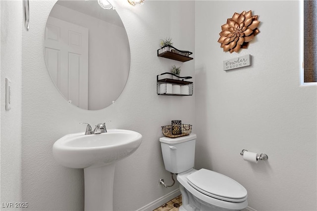 10052 Silver Comet Ct, Las Vegas, NV 89178 - bathroom with baseboards, toilet, and a sink