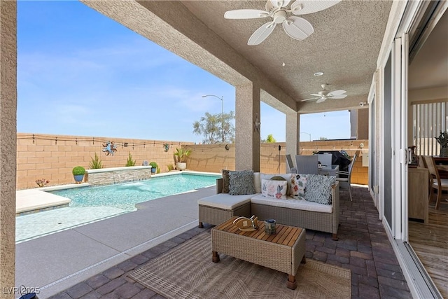 10052 Silver Comet Ct, Las Vegas, NV 89178 - view of swimming pool featuring a ceiling fan, a fenced backyard, a patio, and outdoor lounge area