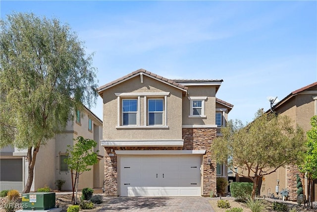 10052 Silver Comet Ct, Las Vegas, NV 89178 - traditional home featuring stone siding, stucco siding, decorative driveway, an attached garage, and a tiled roof
