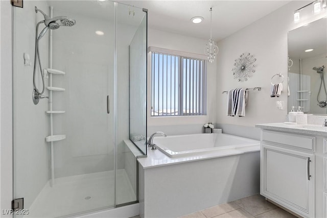 10052 Silver Comet Ct, Las Vegas, NV 89178 - full bathroom with a shower stall, vanity, a bath, tile patterned flooring, and recessed lighting