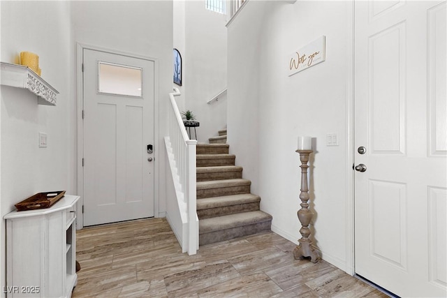 10052 Silver Comet Ct, Las Vegas, NV 89178 - foyer featuring stairs and light wood-type flooring
