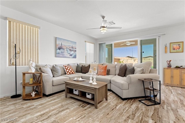 10052 Silver Comet Ct, Las Vegas, NV 89178 - living room with light wood-type flooring and ceiling fan