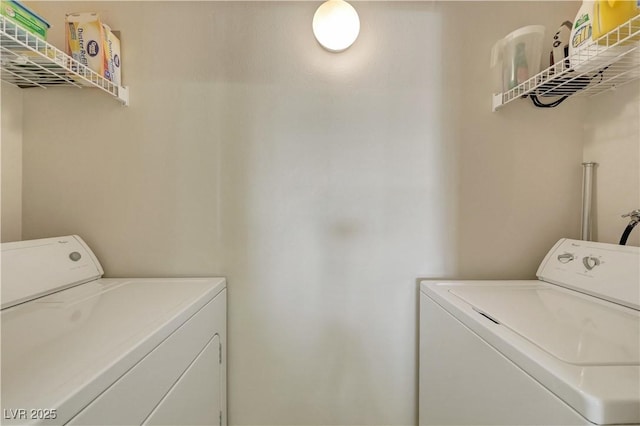 laundry room with washer and clothes dryer and laundry area