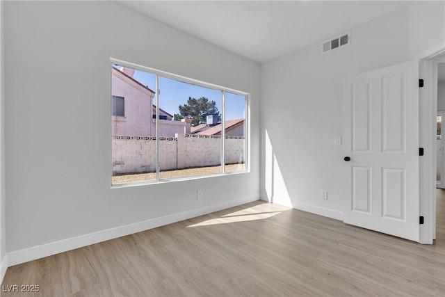 6509 Old Oxford Ave, Las Vegas, NV 89108 - empty room with wood finished floors, baseboards, and visible vents