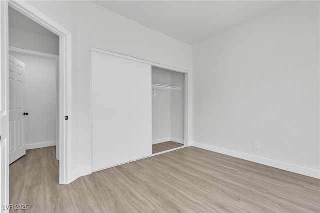 6509 Old Oxford Ave, Las Vegas, NV 89108 - unfurnished bedroom featuring wood finished floors, a closet, and baseboards