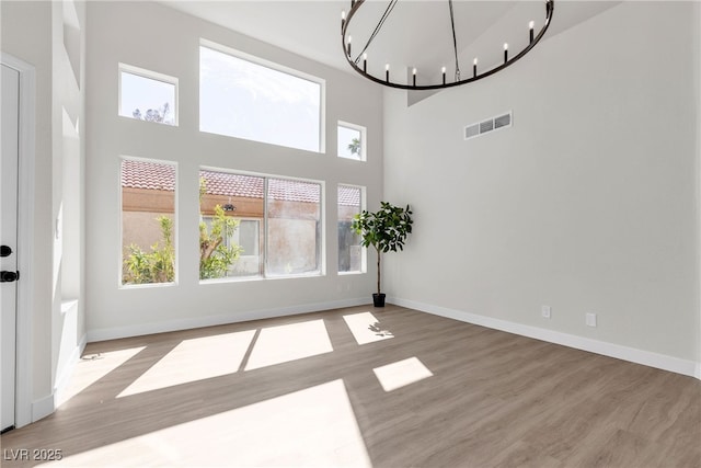 6509 Old Oxford Ave, Las Vegas, NV 89108 - interior space with a chandelier, visible vents, baseboards, and wood finished floors