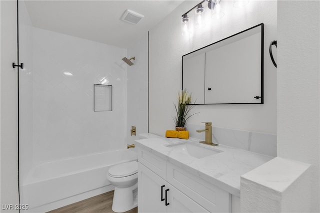 6509 Old Oxford Ave, Las Vegas, NV 89108 - full bath featuring bathtub / shower combination, vanity, visible vents, toilet, and wood finished floors