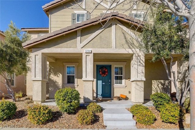 entrance to property with central air condition unit and stucco siding