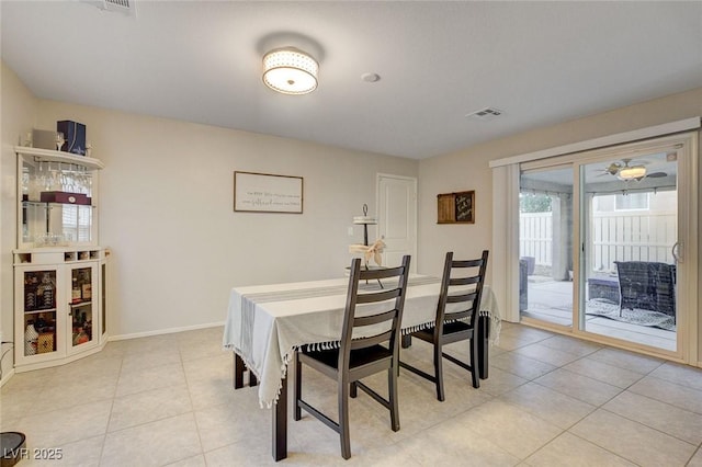 dining area featuring visible vents, baseboards, and light tile patterned floors