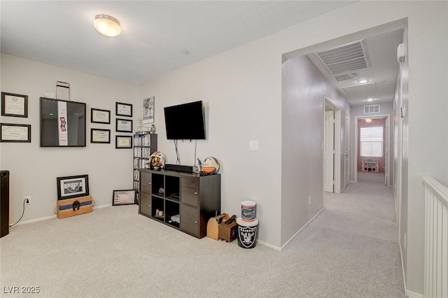 interior space with carpet, visible vents, and baseboards
