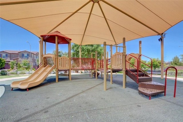 community jungle gym featuring fence