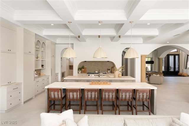 15 Vintage Canyon St, Las Vegas, NV 89141 - kitchen with beamed ceiling, arched walkways, ornamental molding, coffered ceiling, and decorative light fixtures