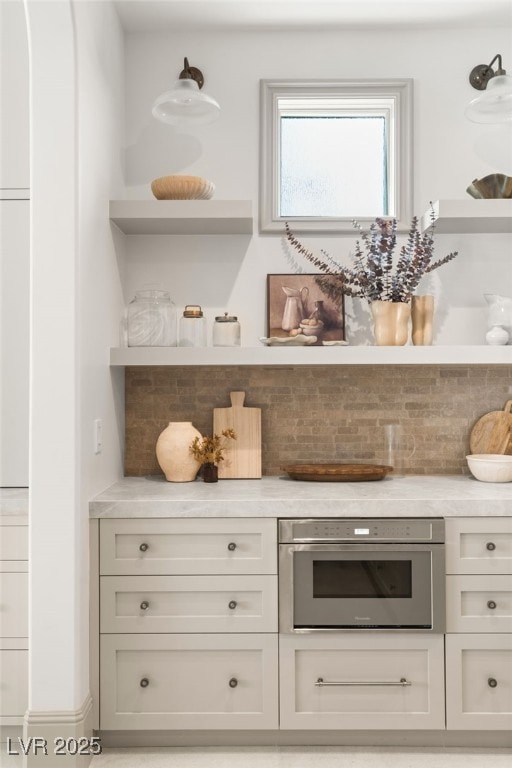15 Vintage Canyon St, Las Vegas, NV 89141 - bar featuring backsplash and stainless steel oven
