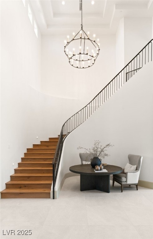15 Vintage Canyon St, Las Vegas, NV 89141 - stairs with a towering ceiling, baseboards, a chandelier, recessed lighting, and tile patterned flooring
