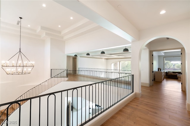 15 Vintage Canyon St, Las Vegas, NV 89141 - corridor with baseboards, arched walkways, a notable chandelier, recessed lighting, and wood finished floors