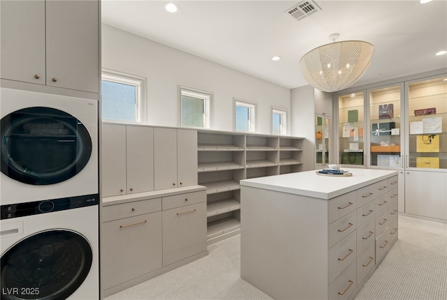 15 Vintage Canyon St, Las Vegas, NV 89141 - walk in closet featuring visible vents, stacked washer and dryer, and light colored carpet