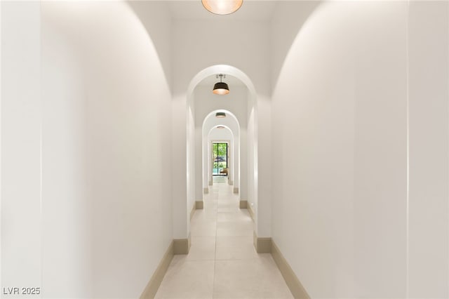 15 Vintage Canyon St, Las Vegas, NV 89141 - hall with arched walkways, light tile patterned floors, and baseboards