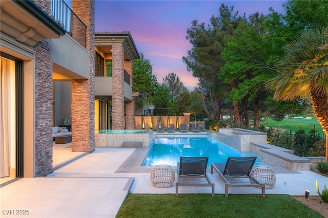 15 Vintage Canyon St, Las Vegas, NV 89141 - pool at dusk featuring a fenced in pool, a patio area, and fence