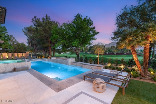15 Vintage Canyon St, Las Vegas, NV 89141 - pool at dusk featuring a patio area, an outdoor pool, and fence