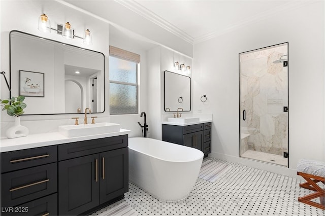 full bathroom with a marble finish shower, crown molding, a soaking tub, two vanities, and tile patterned floors
