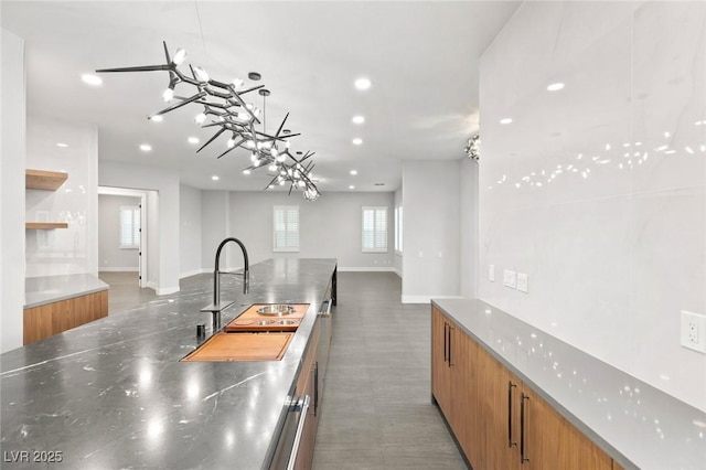 2236 Timber Rose Dr, Las Vegas, NV 89134 - kitchen featuring brown cabinets, open floor plan, modern cabinets, and stainless steel counters