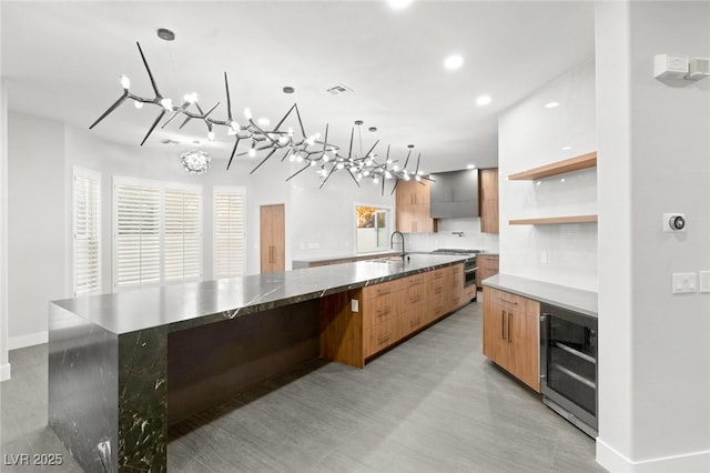 2236 Timber Rose Dr, Las Vegas, NV 89134 - kitchen featuring wine cooler, an inviting chandelier, a sink, and modern cabinets