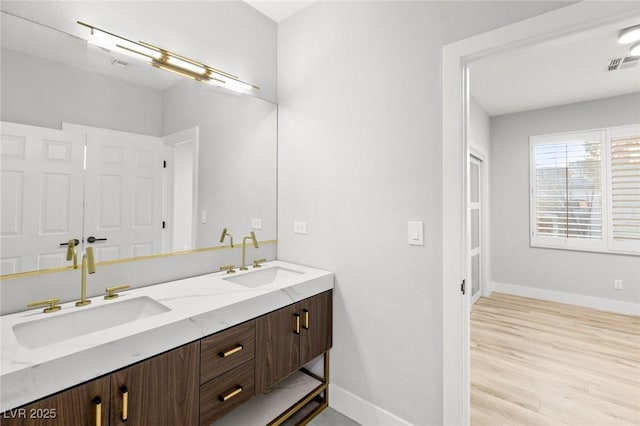 2236 Timber Rose Dr, Las Vegas, NV 89134 - bathroom featuring a sink, visible vents, baseboards, and double vanity
