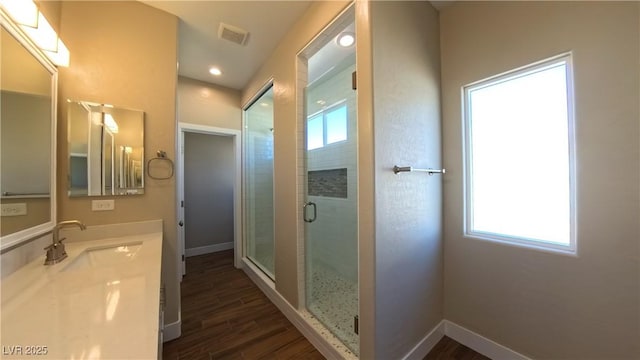 1931 Rose Ct, Pahrump, NV 89048 - bathroom with healthy amount of natural light, a shower stall, and wood finished floors