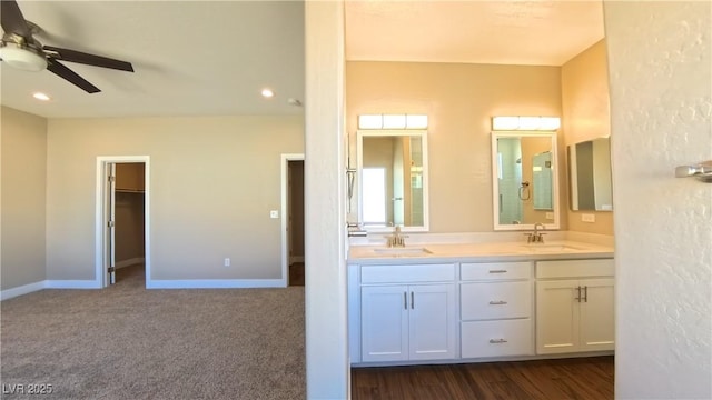 full bath featuring a sink, a ceiling fan, recessed lighting, and double vanity