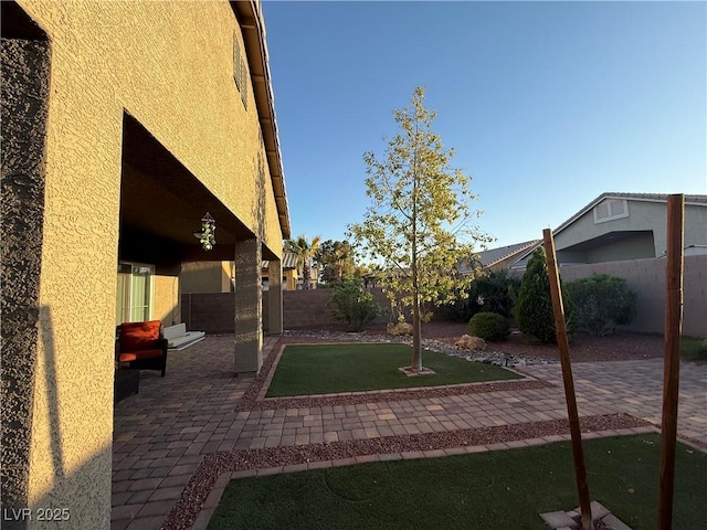 view of yard featuring a fenced backyard and a patio