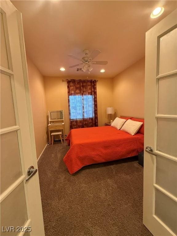 carpeted bedroom featuring baseboards, recessed lighting, and a ceiling fan