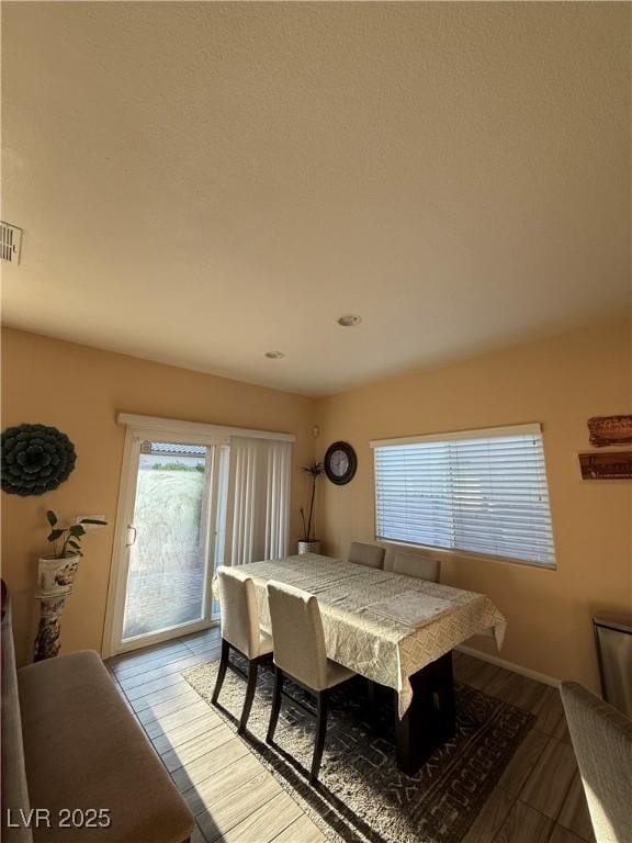 dining area featuring visible vents and recessed lighting