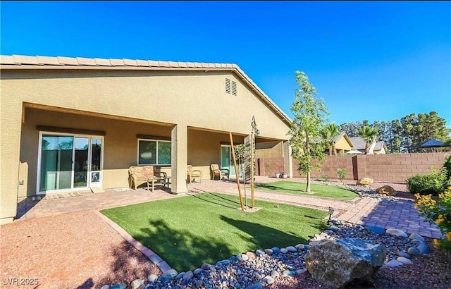 4837 Skyraider St, North Las Vegas, NV 89031 - back of house with stucco siding and a patio