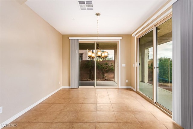 unfurnished dining area featuring light tile patterned flooring, an inviting chandelier, baseboards, and visible vents