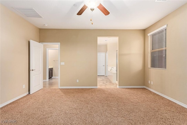 unfurnished bedroom with light carpet, baseboards, and visible vents