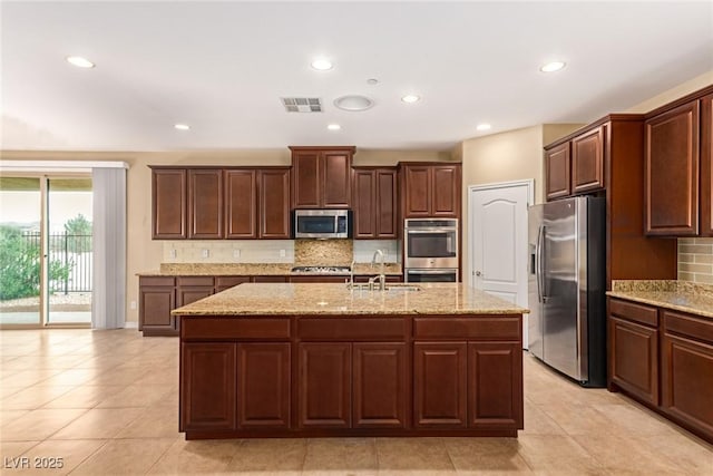 kitchen with recessed lighting, visible vents, a sink, and appliances with stainless steel finishes