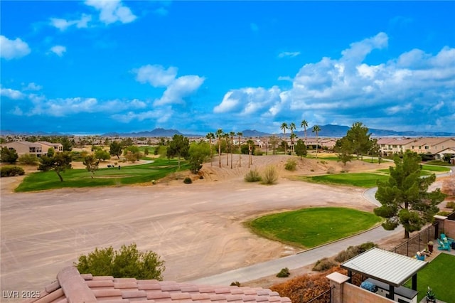 surrounding community featuring a mountain view, fence, view of golf course, and a residential view