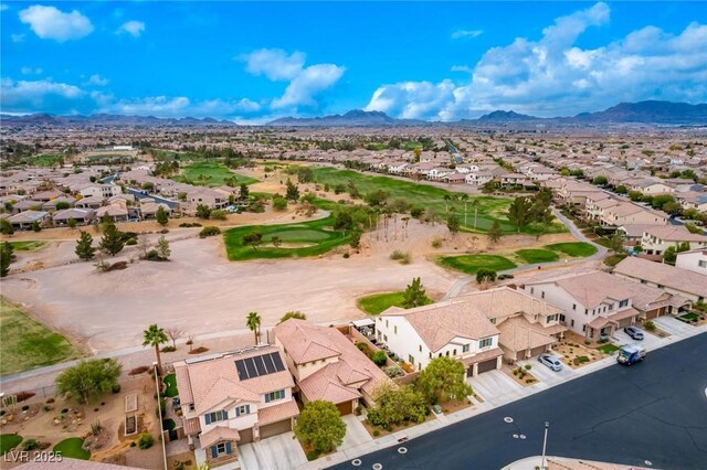 birds eye view of property with a mountain view, golf course view, and a residential view