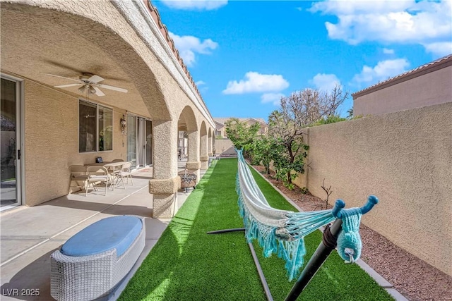9155 Bush Poppy Ave, Las Vegas, NV 89147 - view of yard with ceiling fan and a patio area